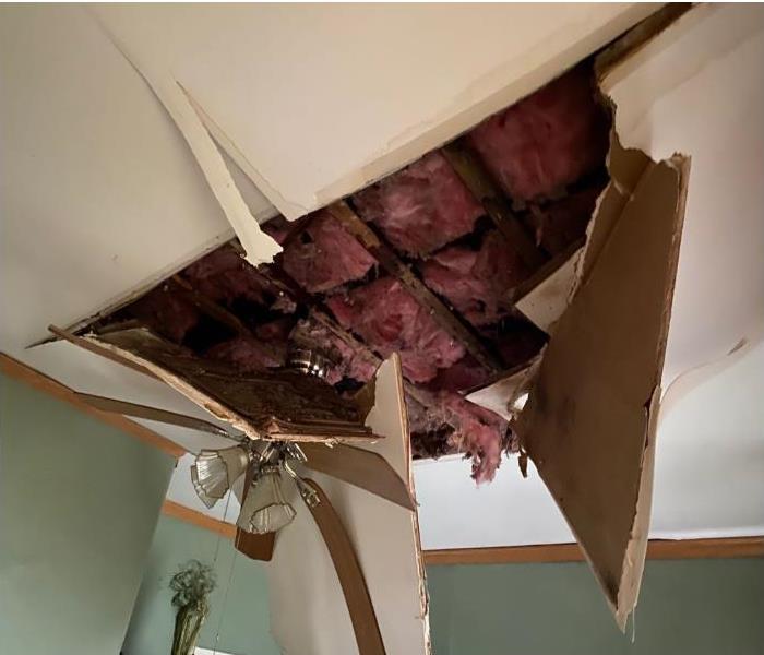 collapsed ceiling with exposed insulation