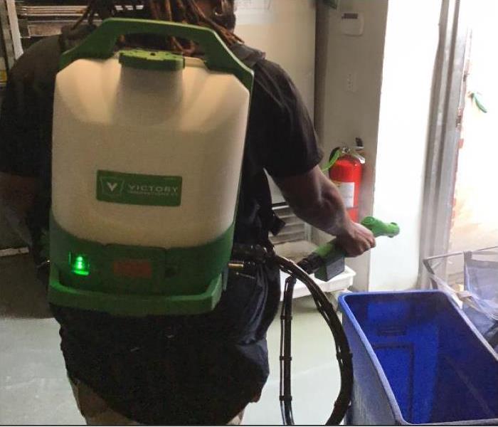 Cordless Electrostatic Backpack Sprayer on technicians back