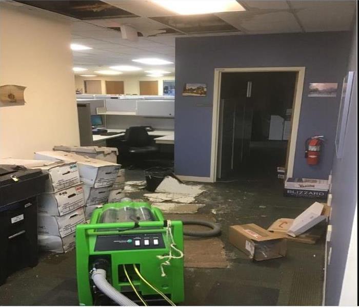 files and ceiling damaged by water in office building
